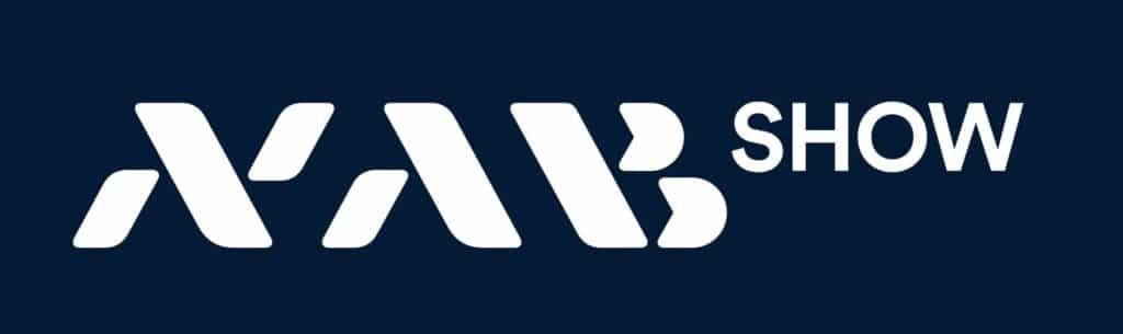 Dark blue event banner displaying the NAB Show logo with stylized white lettering on a solid background, representing the NAB Show broadcast and media technology conference.