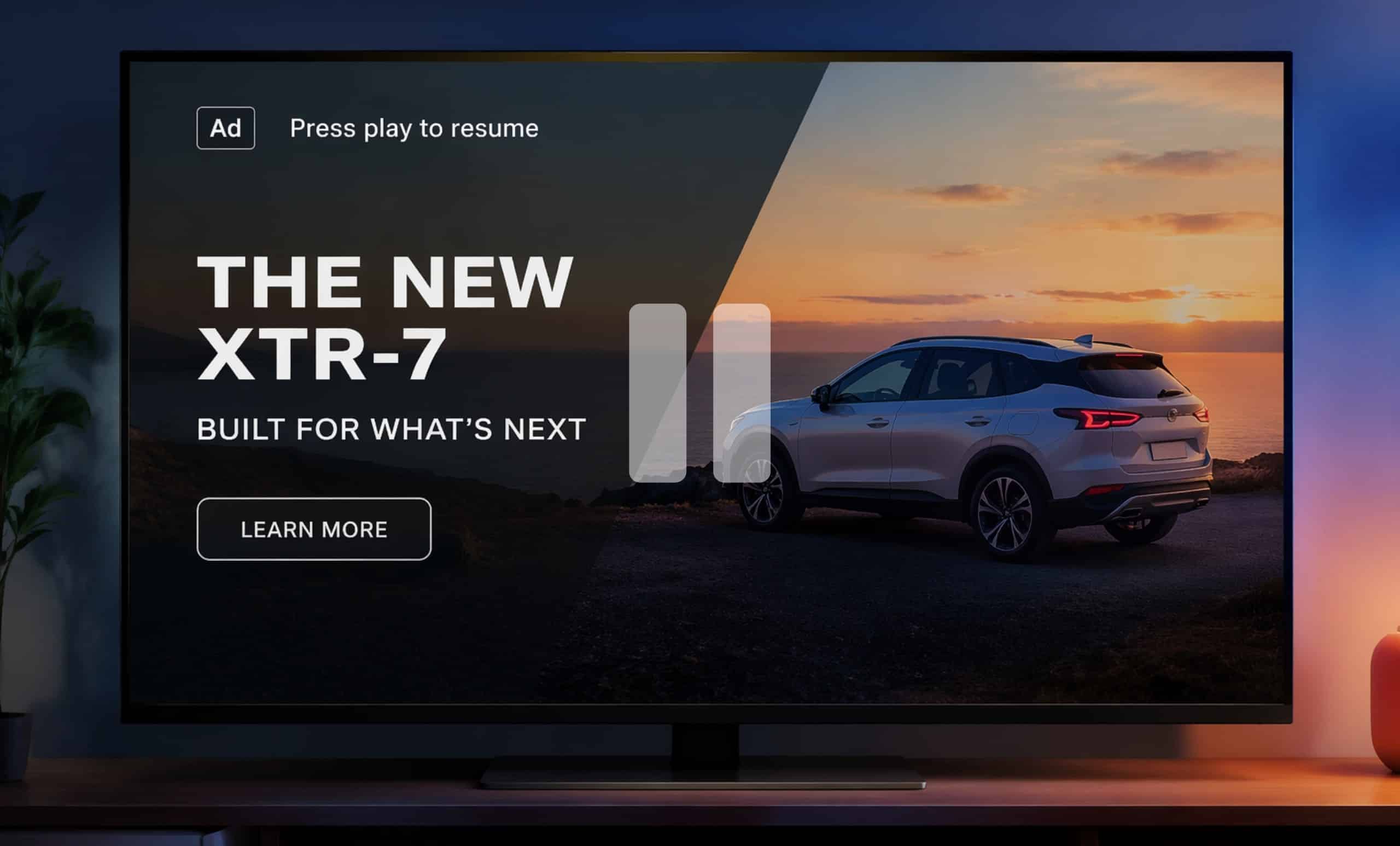 Pause Ad illustration. A modern flat-screen TV in a dimly lit living room displays a paused advertisement featuring a sleek SUV at sunset, with overlay text “The New XTR-7,” a “Learn More” button, and a visible pause icon indicating viewer-initiated ad playback.