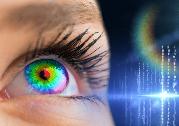 Close‑up image of a human eye with a multicolored iris, overlaid with abstract digital data and light effects representing technology and data processing