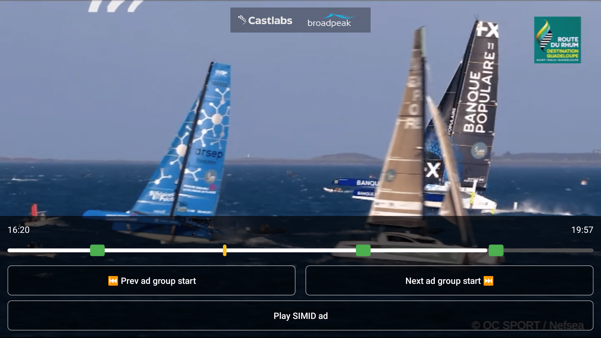 Live sailing race video playing in a Castlabs and Broadpeak SGAI player interface, illustrating selective ad resolution within a DVR window. The timeline shows multiple ad break markers, navigation controls for previous and next ad groups, and SIMID ad interaction options, demonstrating just‑in‑time ad resolution during time‑shifted live streaming.